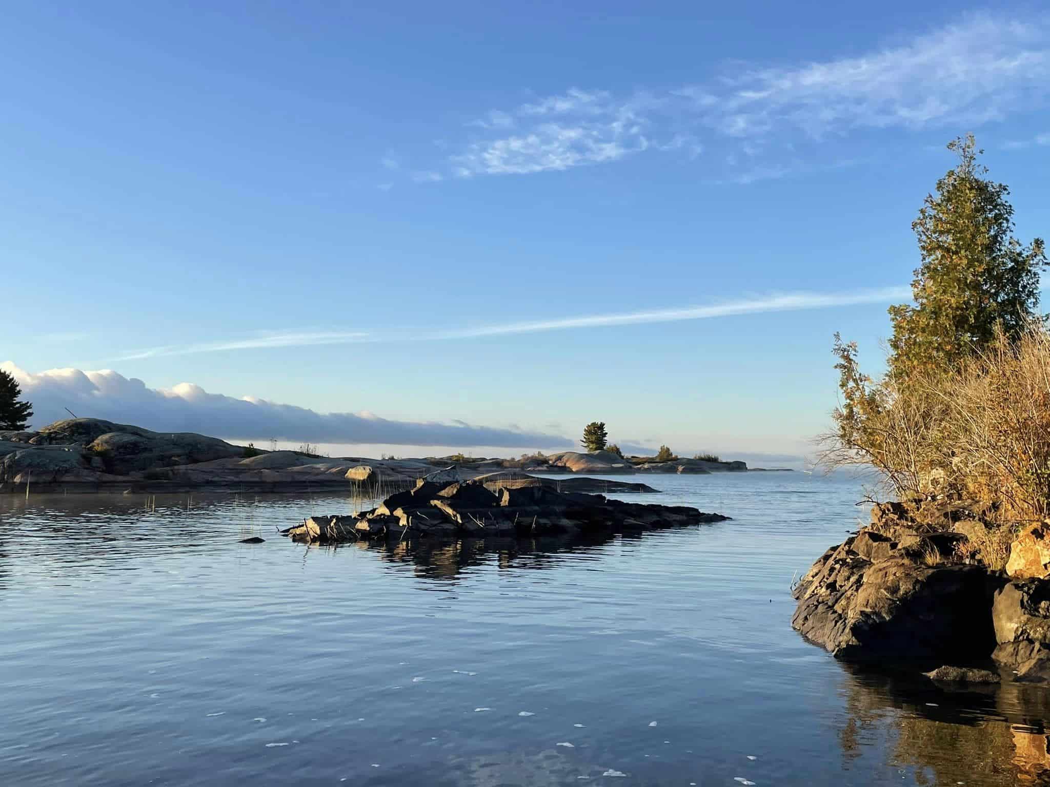 Still morning water around granite islets